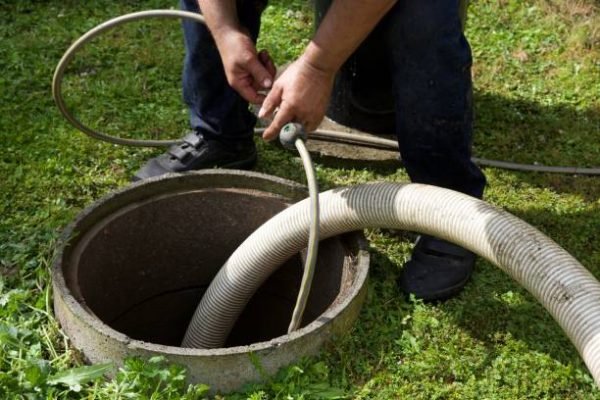 the removal of sewage sludge and cleaning of a domestic septic tank at a rural French home